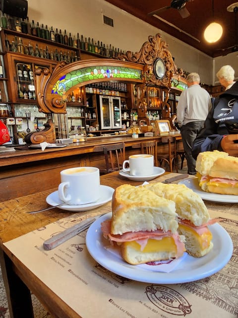 Walking Tour of San Telmo and La Boca with local food - Maradona themed bar finish: a drink with football nostalgia